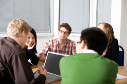 Students discussing MikesBikes-Advanced Business Simulation